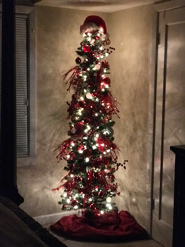 Stop cat from climbing christmas outlet tree